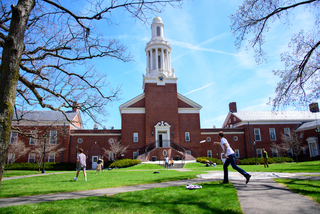 Students playing frisbee on the quad.