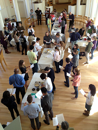 students gathered around tables in Marquand Chapel
