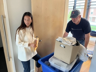 Dean Sterling helping Karen Phan, the first student to move into LV